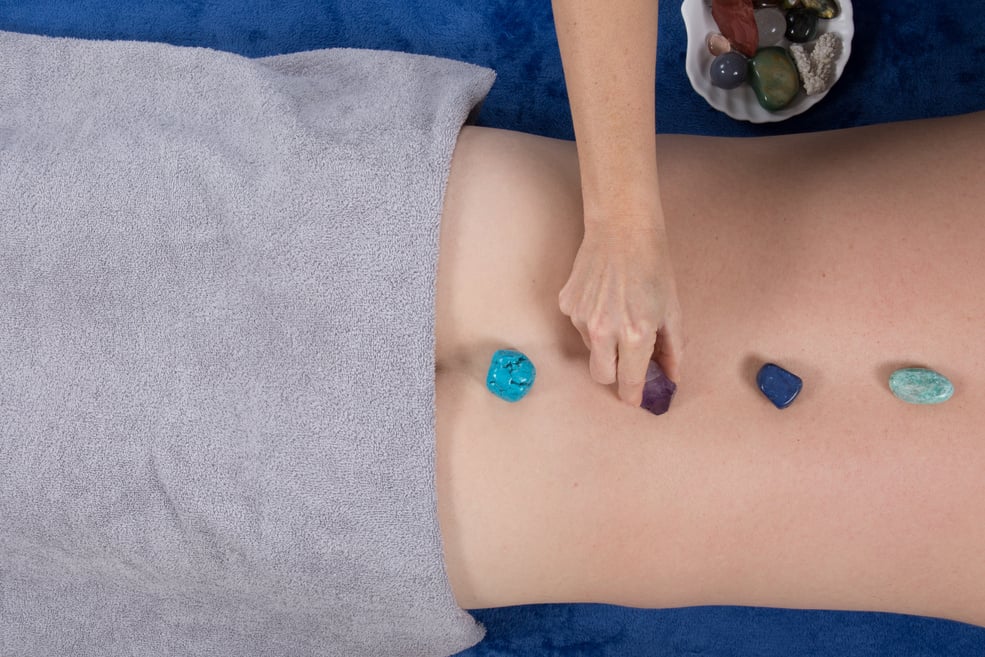 Alternative medicine, therapist using gemstones for lithotherapy